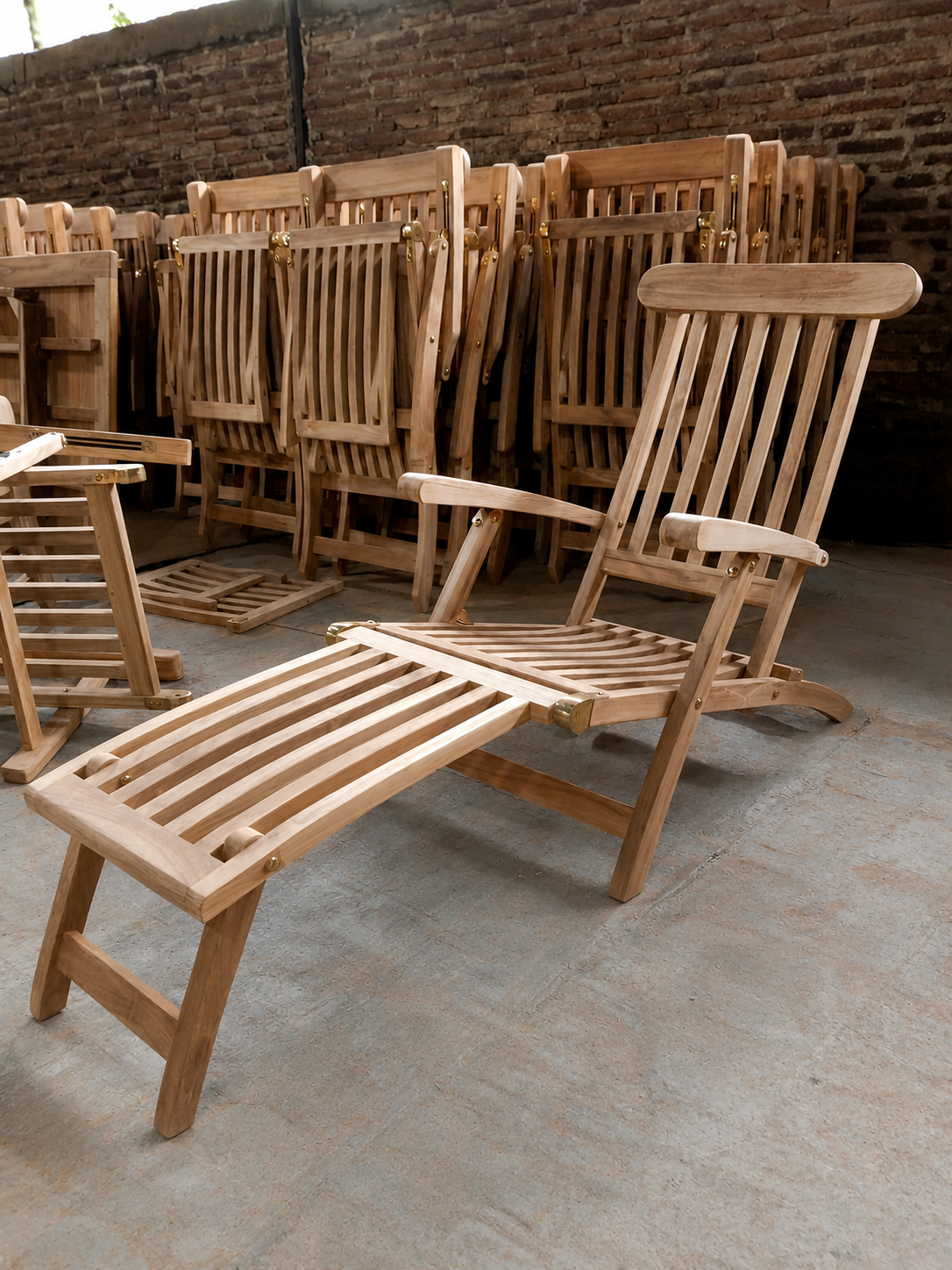 Handcrafted Indonesian teak garden rocking chair with matching footrest