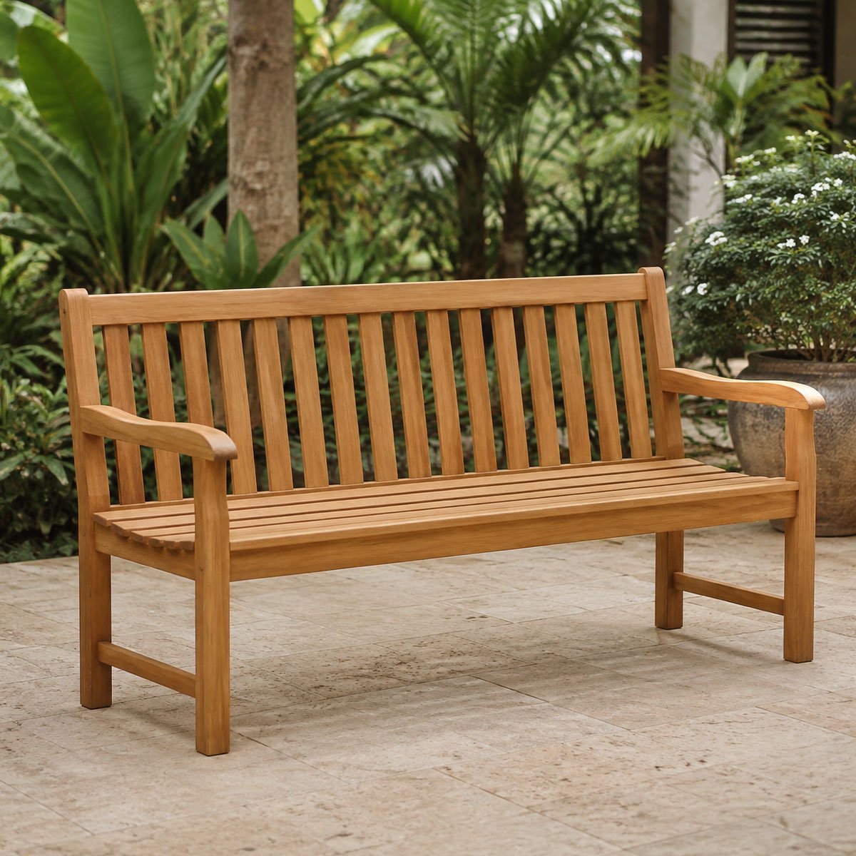 Indonesian teak three-seater garden bench on a tropical terrace